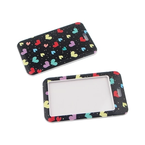 Detailed view of heart pattern card holders showing front window and patterned back