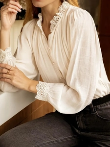 Elegant cream long sleeve shirt for women featuring delicate lace trim and textured fabric