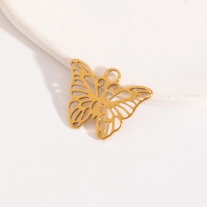 Macro view of a gold hollow butterfly pendant with fine detail and mounting ring