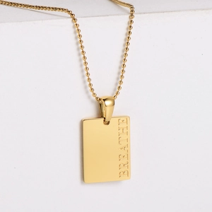 Golden industrial style square pendant necklace with BREATHE engraving and ball chain
