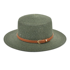 Detail of dark green woven straw hat featuring a flat top and leather belt with gold buckle