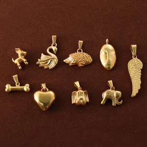 Collection of vintage 24k gold plated stainless steel animal and heart pendants