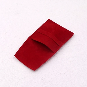 Detail view of the red velvet jewelry pouch showing the envelope flip cover design