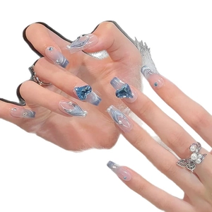 Blue gradient press-on nails featuring heart crystals, mini diamonds and pearl accents