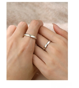 Detailed view of S925 sterling silver couple rings with elegant gold line accent