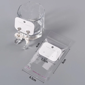 Elegant white floral earrings with crystal drop on s925 silver needle display card