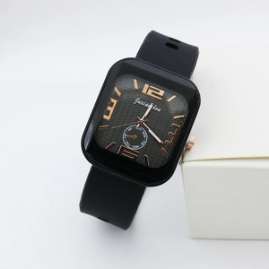 Detail of square quartz watch featuring rose gold markers and black silicone strap