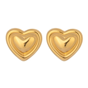 Detail of double-layer 3D golden heart earrings with polished finish on white background
