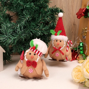 Plush gingerbread bird ornaments with candy canes for festive Christmas tree decoration