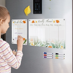 Acrylic magnetic weekly planner set on fridge with floral pattern and markers for kids