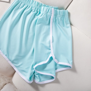 Flat lay of light blue athletic shorts with elastic waist and white contrast binding detail