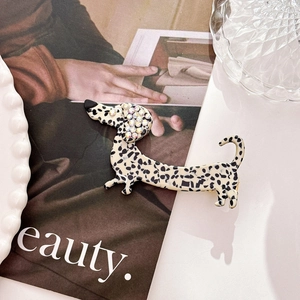 Detail of dachshund hair clip with acetate polka dots and rhinestone-encrusted dog ears
