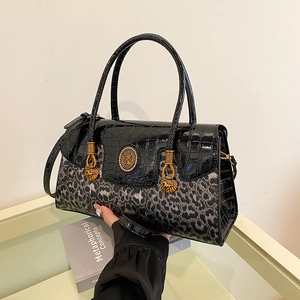 Chic leopard print and black crocodile embossed crossbody bag with gold hardware detail