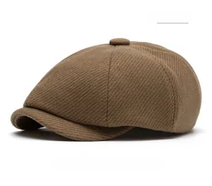 Detailed view of coffee brown wool blend newsboy cap with twill texture and top button