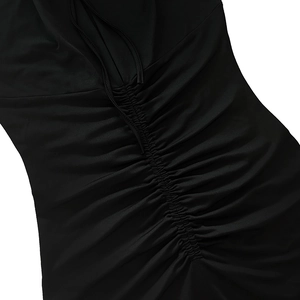 Detailed view of the elegant ruching and adjustable drawstring design on a black slim dress