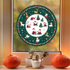 Detailed view of Christmas window stickers featuring Santa Claus and Reindeer on glass