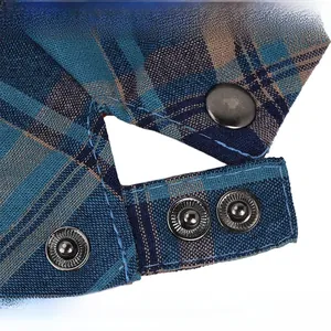 Detail of adjustable stainless steel buckle on a colorful plaid cotton flat cap