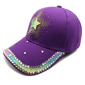 Detail of dark purple star baseball cap with sparkling rhinestones and studs
