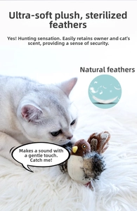 Cat watching a lifelike chirping bird toy with real feathers on a soft white carpet
