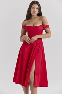 Detailed view of the side slit on a red floral off-shoulder slim fit maxi dress