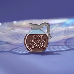 Coffee pot enamel pin with POT head lettering and polished silver metal edges