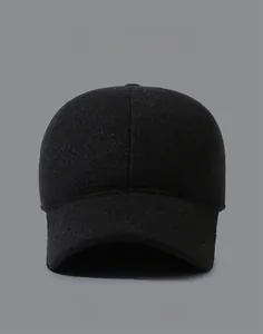 Detail view of winter baseball cap with ear flaps and metallic MR side logo for men