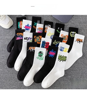 Close-up of street style cotton crew socks featuring graffiti prints and urban graphics