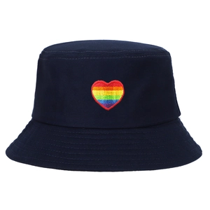 Front view of navy blue bucket hat featuring a vibrant rainbow heart embroidery.