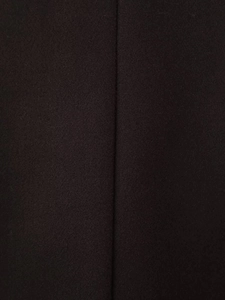 Close-up of the premium wool blend fabric texture of the long winter coat