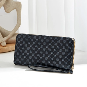 Black long wallet with blue-grey floral patterns, gold zipper and wrist strap