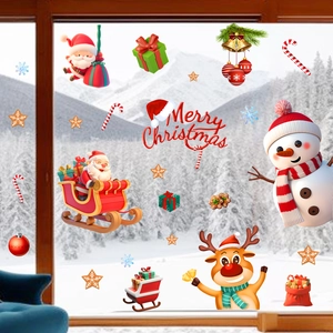 Detail of 3D Christmas window stickers with Santa, snowman and reindeer on glass surface