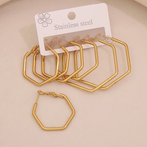 Detail showing various sizes of golden stainless steel hexagonal hoop earrings on display card