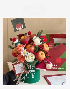 Detailed Christmas flower bucket with apples, roses, and festive snowman ornaments