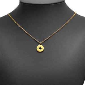 Gold vacuum-plated stainless steel compass necklace with hollow round pendant for women