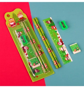 Close-up of a 5-piece Christmas stationery set with pencils, ruler, eraser and sharpener