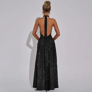 Macro view of backless halter evening dress with shimmering glitter fabric texture