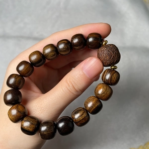 Dark brown sandalwood prayer beads bracelet with engraved characters on main bead