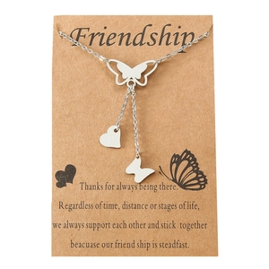 Silver stainless steel butterfly and heart pendant necklace displayed on a friendship card