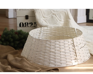 Detail of white woven Christmas tree base cover skirt for holiday home floor decoration