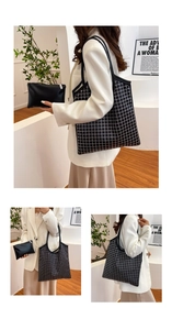 Detail of black plaid tote bag set with matching pouch and white grid pattern detail