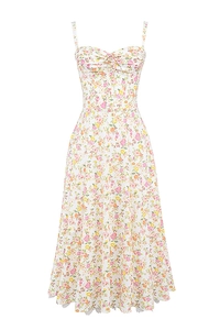 Detailed view of floral pattern on light beige summer slip dress with soft colors