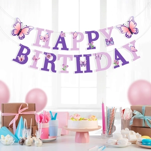 Purple butterfly happy birthday banner hanging over a decorated tea party table