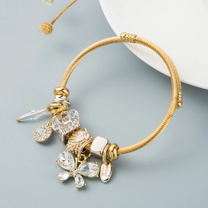 Adjustable gold twisted bracelet with butterfly charm and handmade engraved pendant
