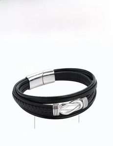 Detailed view of multilayer black leather bracelet with stainless steel magnetic clasp