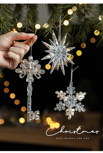 Clear acrylic Christmas ornaments featuring star and snowflake shapes with silver sequins