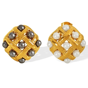 French vintage rhombus stud earrings with woven gold frame and pearls on white background