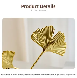 Close-up of golden iron ginkgo leaf ornament showing realistic vein texture and metallic finish