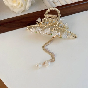 Elegant gold lily of the valley hair claw clip with pearl pendants and resin flowers