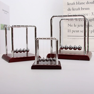 Three sizes of classic Newton's Cradle kinetic desk toys with metal frames and wooden bases