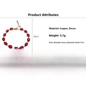 Detail view of oval red zircon gold bracelet with adjustable lobster clasp and chain
